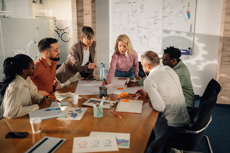 Diverse team of marketing professionals working together on a project in a modern office