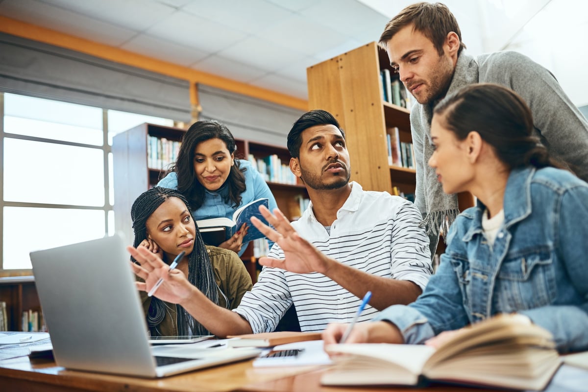 Cropped shot of a group of university students studying in the library